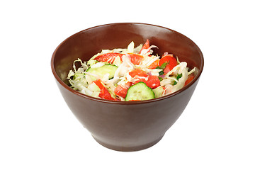 Image showing fresh salad with tomato, cabbage and cucumber on bowl isolated on white 