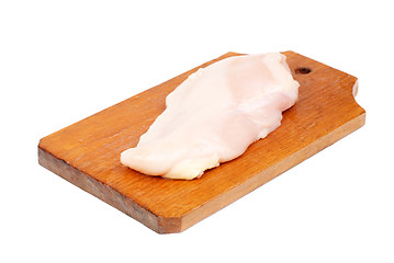 Image showing chicken meat sliced   on  cutting  board isolated  on  white  background