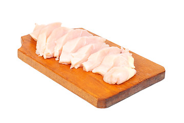 Image showing chicken meat sliced   on  cutting  board isolated  on  white  background