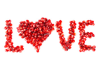 Image showing word of love from the seeds of a pomegranate isolated on  white