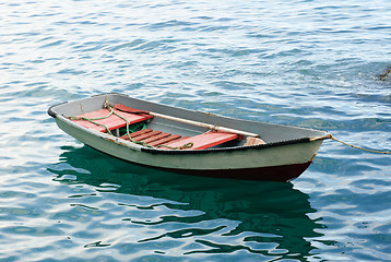 Image showing Lifeboat with paddle. Old wooden boat 