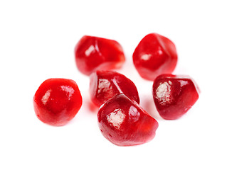 Image showing Some garnet seeds isolated on white background 