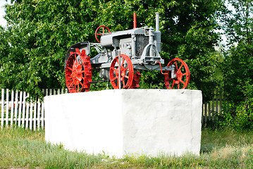 Image showing An old tractor on a white pedestal.Ukraine. Poltava  region.