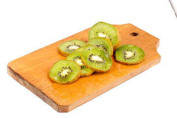 Image showing slice of kiwi fruit on  cutting board isotated on a white background 