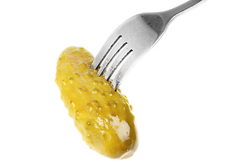 Image showing Marinated cornichon on the fork isolated on the white background 