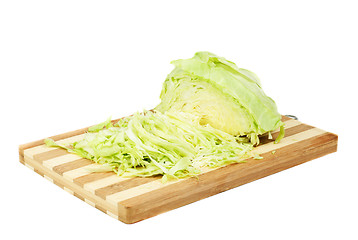 Image showing Green cabbage sliced on cutting board isolated  on  white