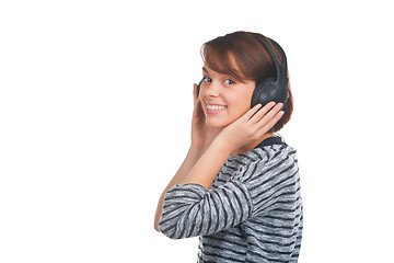 Image showing Pretty young girl listening music