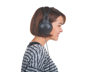 Image showing Pretty young girl listening music