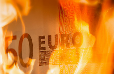 Image showing 	euro banknotes burning