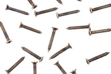 Image showing Brass screws on a white  as fine background 