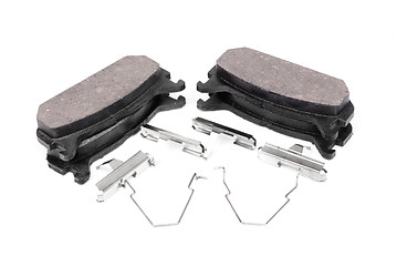 Image showing four brake pads and spring, isolatet on white 