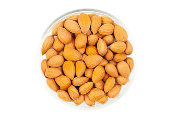 Image showing Dried almonds on glass bowl isolated on a white background 