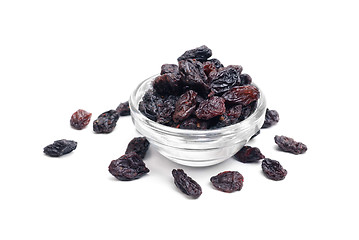 Image showing dark  raisins close- up in glass bowl isolated  on  white background