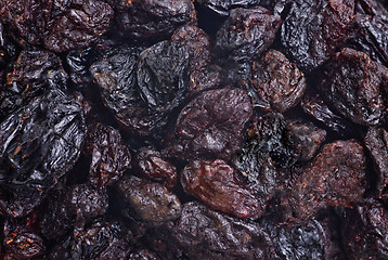 Image showing dark dried raisins  close- up food background 