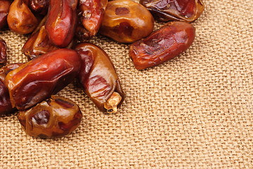 Image showing dried dates on canvas background