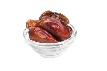 Image showing dried dates on glass bowl isolated on white background