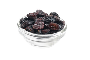 Image showing dark  raisins close- up in glass bowl isolated  on  white background