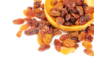 Image showing raisins and  wooden  spoon close- up  isolated on  white background 