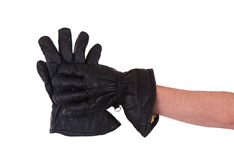 Image showing Mans hand in very old black leather glove