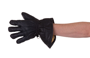 Image showing Mans hand in very old black leather glove