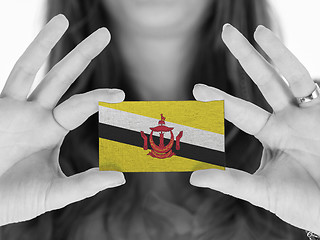 Image showing Woman showing a business card