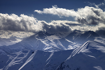 Image showing Evening mountains in sunlight clouds