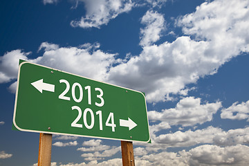 Image showing 2013, 2014 Green Road Sign Over Clouds