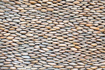 Image showing stone wall, lined with pebbles