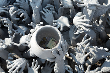 Image showing Sculptural composition with his hands and cup