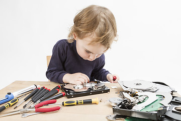 Image showing child repairing hard disk drive