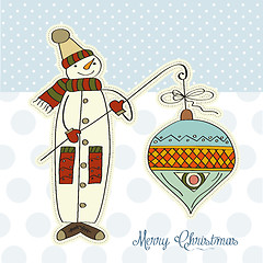 Image showing snowman with big Christmas ball