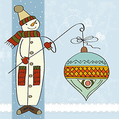 Image showing snowman with big Christmas ball