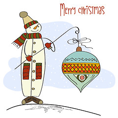 Image showing snowman with big Christmas ball