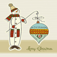 Image showing snowman with big Christmas ball