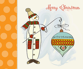 Image showing snowman with big Christmas ball