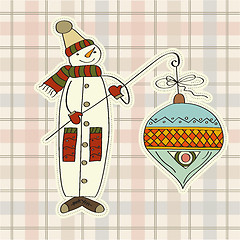 Image showing snowman with big Christmas ball