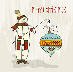 Image showing snowman with big Christmas ball