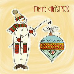 Image showing snowman with big Christmas ball