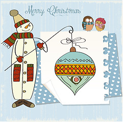 Image showing snowman with big Christmas ball