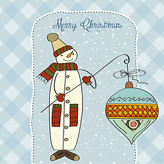 Image showing snowman with big Christmas ball