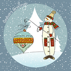 Image showing snowman with big Christmas ball