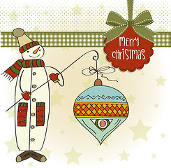 Image showing snowman with big Christmas ball