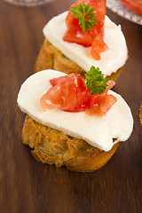 Image showing Bruschetta with mozarella and tomatoes