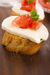 Image showing Bruschetta with mozarella and tomatoes