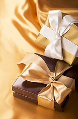 Image showing brown box with candies and golden tape