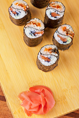 Image showing sushi rolls with tobico and pancake