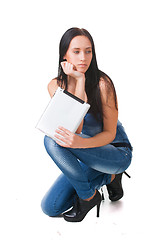 Image showing Young girl posing in studio with tablet pc