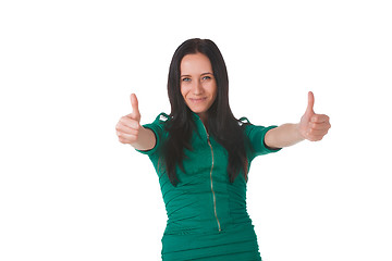 Image showing Girl in green dress shows thumbs up