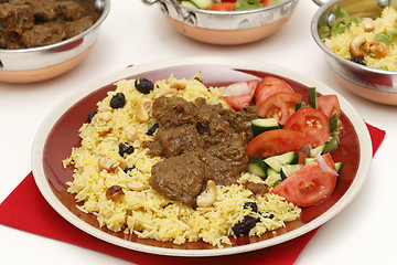 Image showing Beef curry with serving bowls