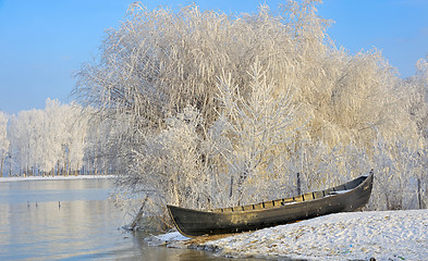 Image showing Frosty winter trees and boat